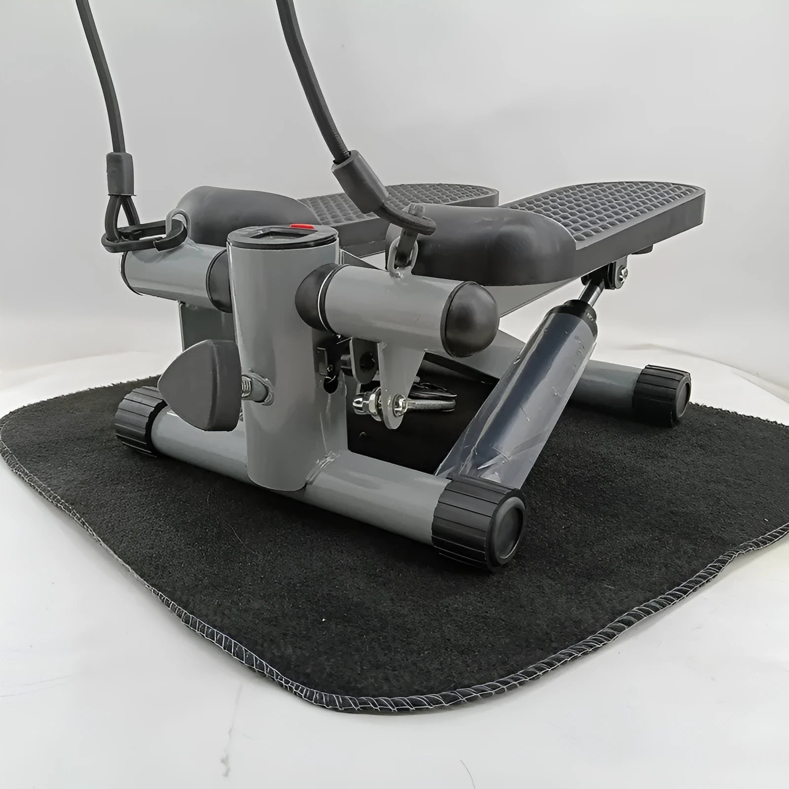 Silver grey household mini treadmill with hydraulic resistance system for waist slimming.