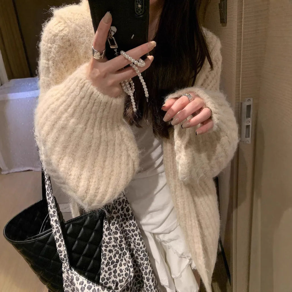 Women's thick hooded cardigan in loose fit, shown in dark grey, brown, and milky white solid colours.