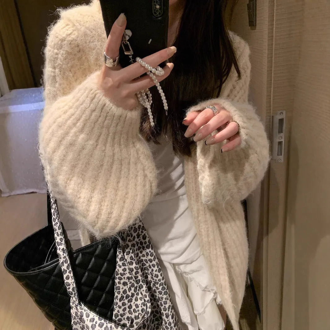 Women's thick hooded cardigan in loose fit, shown in dark grey, brown, and milky white solid colours.