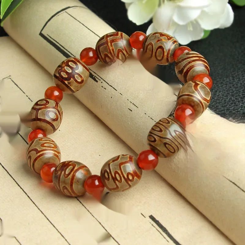 Distressed agate Tibet beads bracelet with three eye dzi design and polished stone beads