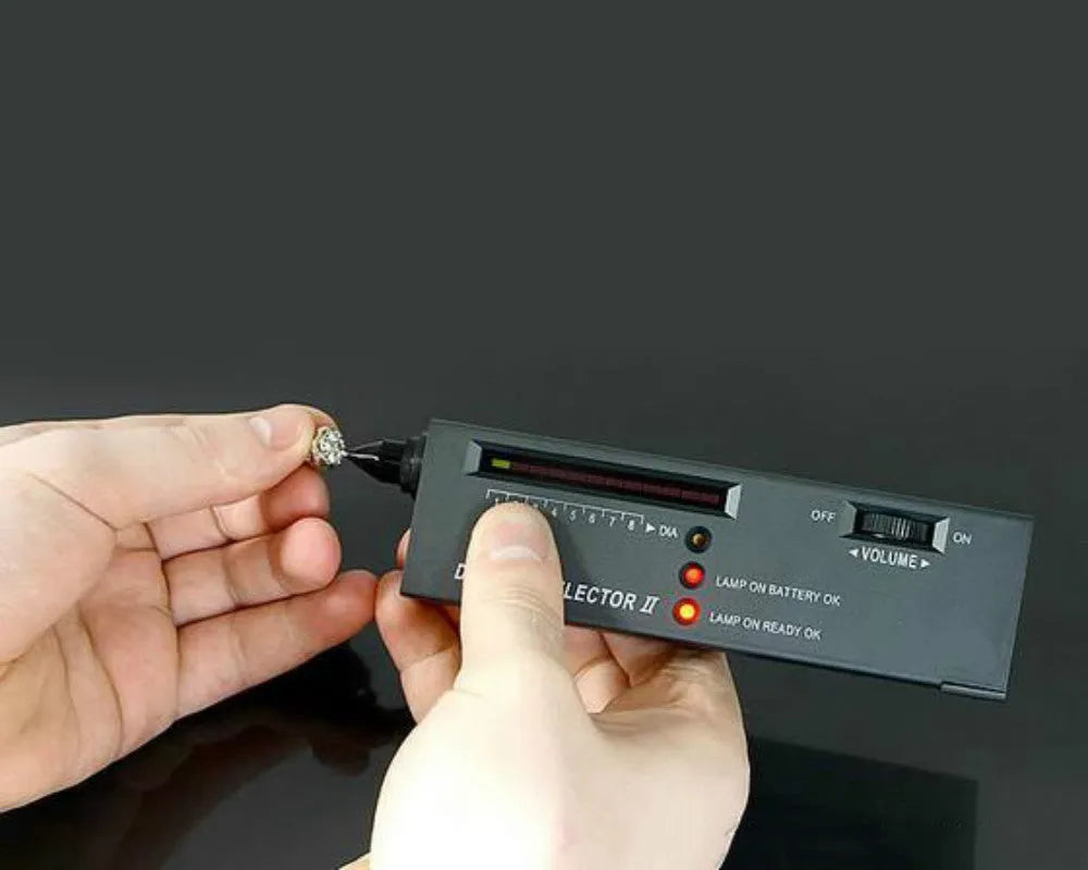 Second generation black diamond thermal conductivity tester with metal probe for gem identification.