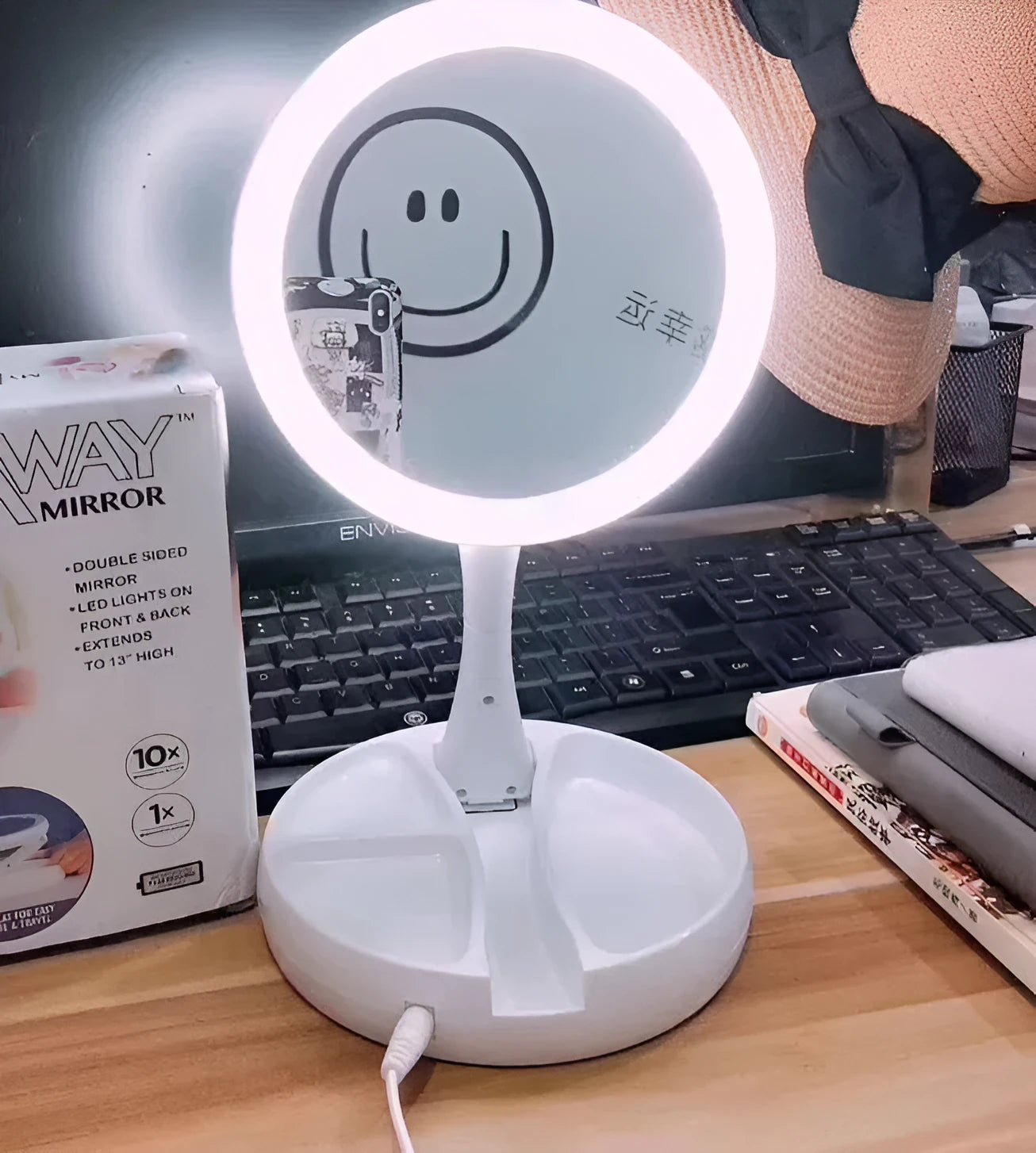 White foldable LED vanity mirror with storage compartments and USB charging port