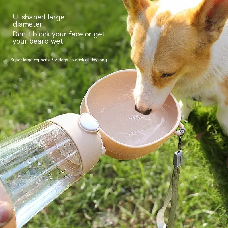 Portable dog water bottle and feeder with attached food container and bowl in yellow, pink, or brown.