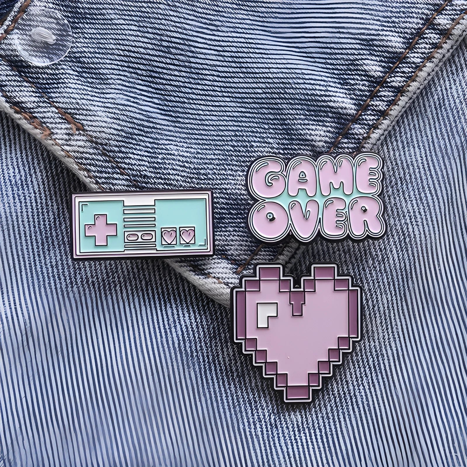 Stereo alloy game console badge with magnetic fastening in silver, gunmetal, or bronze.