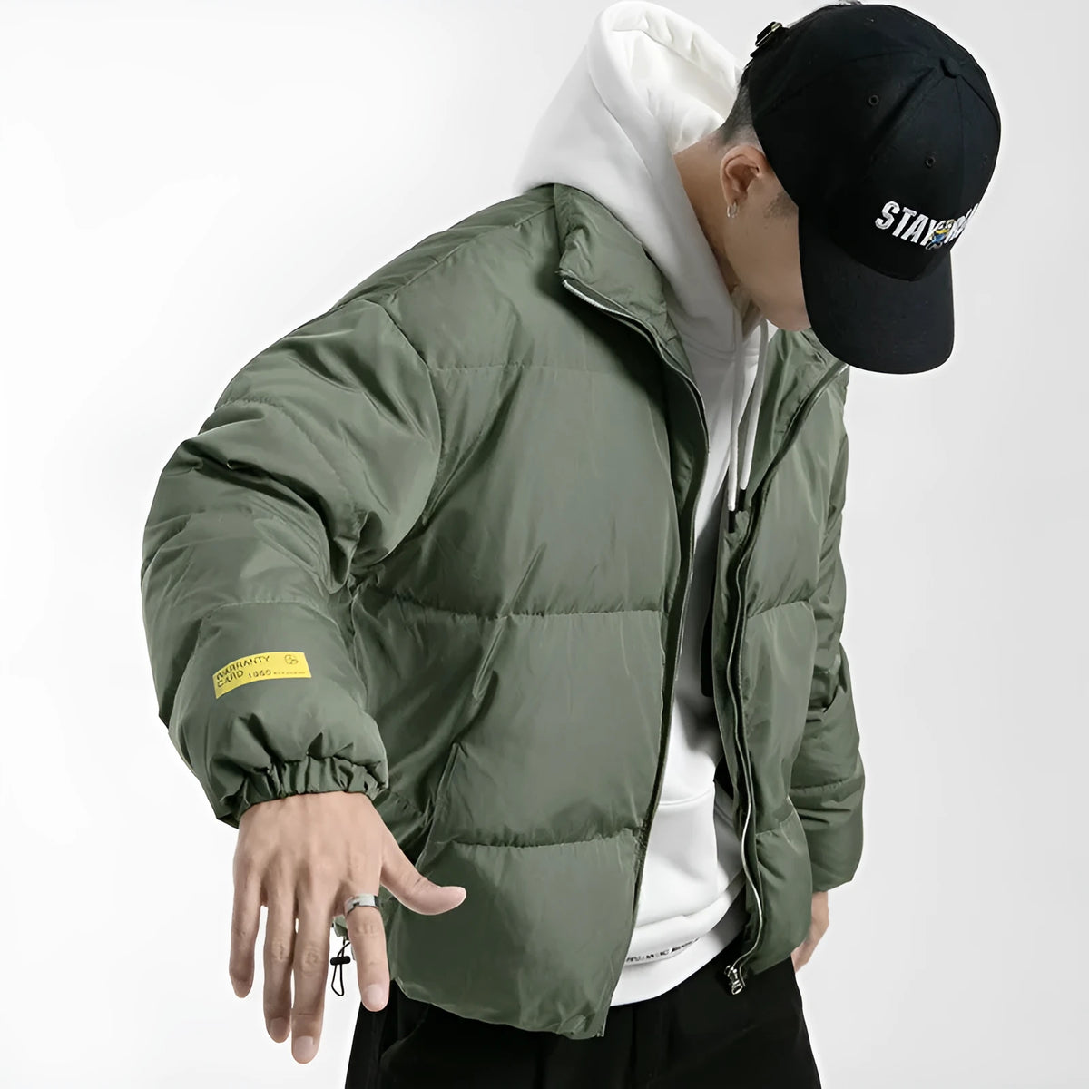 Men's stand collar padded jacket with zip front, side slit pockets, and straight hem in black, green, or grey.