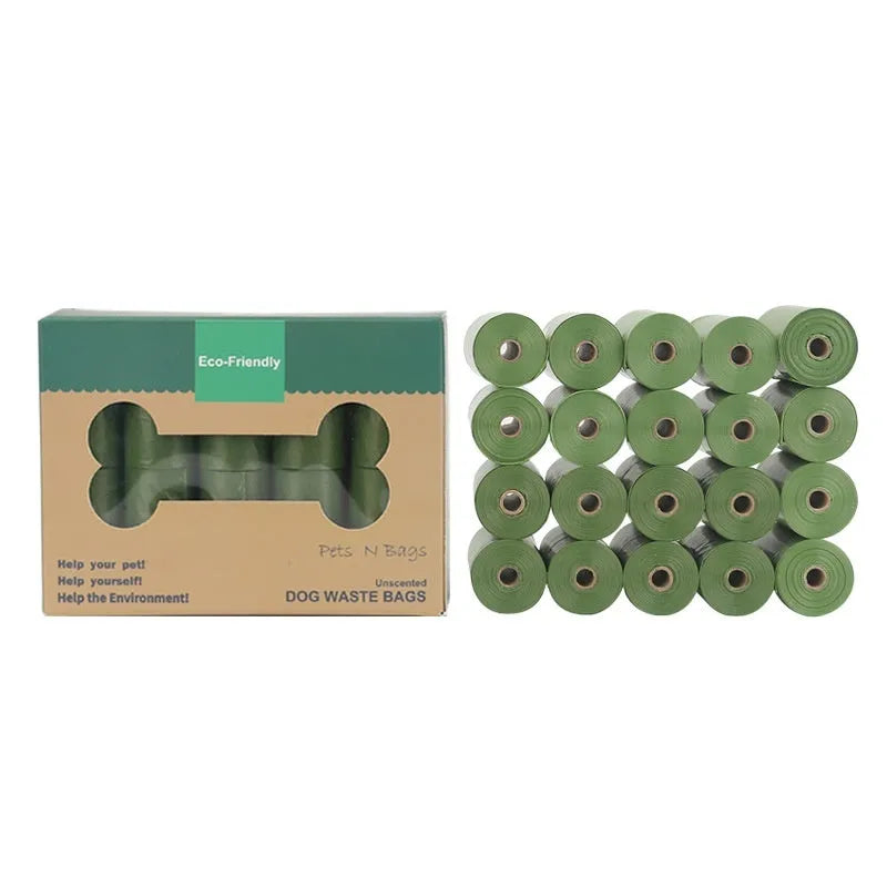 Green EPI degradable pet waste bags on a roll next to a white dispenser.