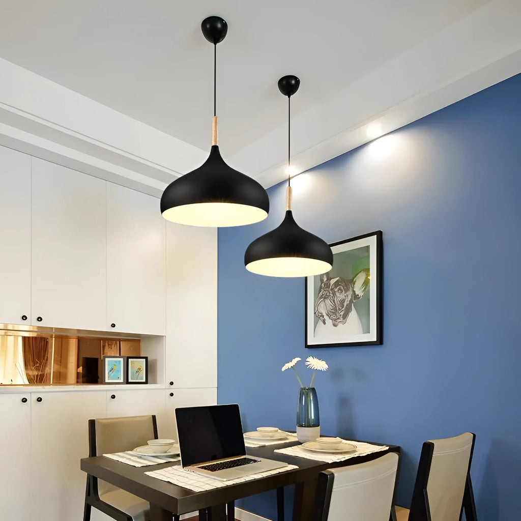 Creative macarone style single-head fishline pendant lamp with adjustable cord against a coloured background.