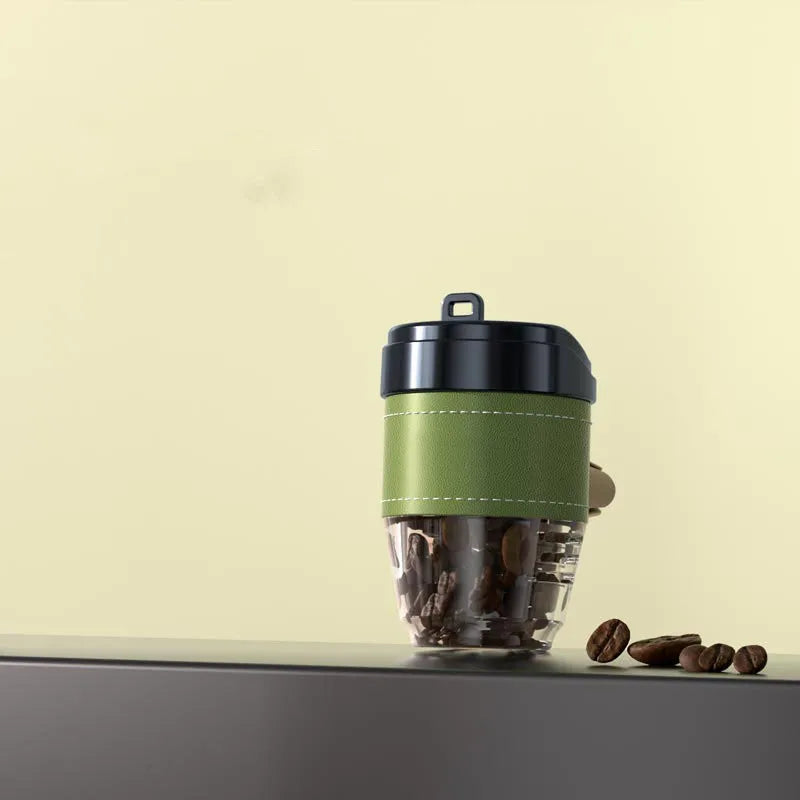 Coffee cup shaped solid car air freshener in black, brown, white, orange, and green colours.