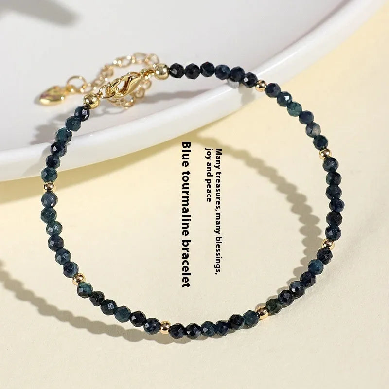 Blue tourmaline bracelet with 3mm cut beads and spacer bead design for women