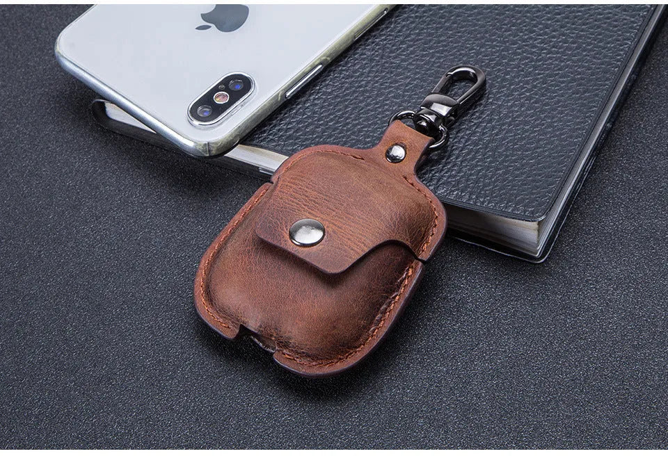 Crazy horse cowhide leather AirPods cover with keychain and charging hole, 6.8cm x 12.3cm, in blue, brown, coffee, or red.