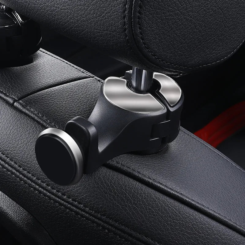 Adjustable car hook attached to headrest pole in silver colour for hanging bags