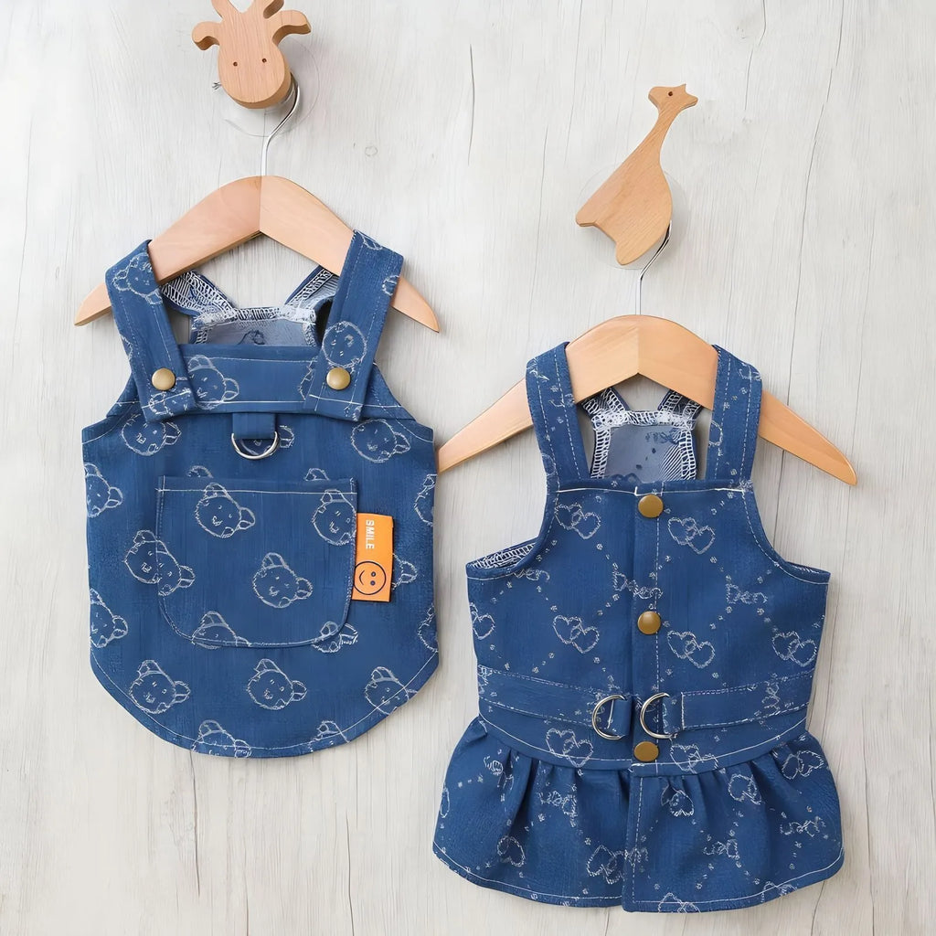 Small dog wearing denim princess dress with bracket skirt design in blue denim fabric