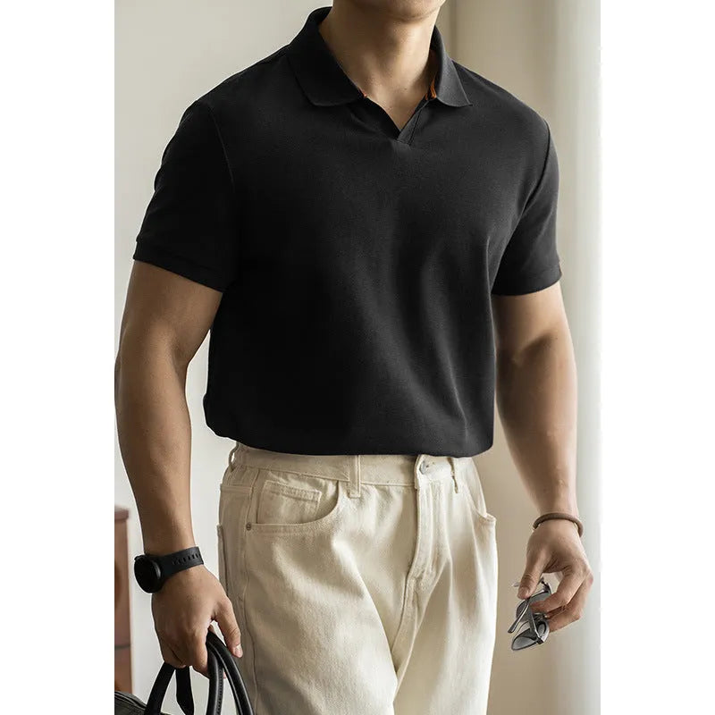 Men's blue short-sleeved cotton blend polo shirt on a hanger, showing regular fit and casual style.