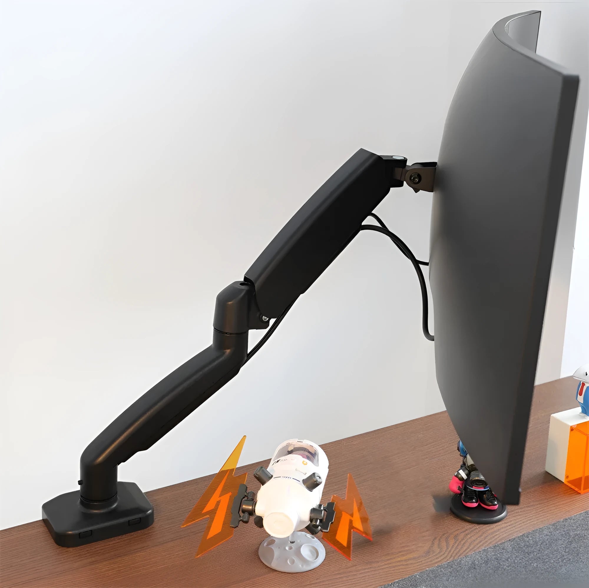 Black rotating telescopic LCD screen bracket mounted on desk edge showing adjustable arm and elevated rack design