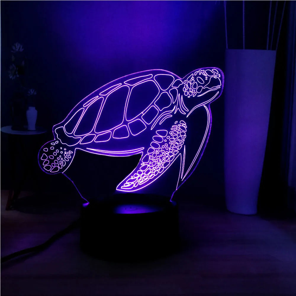 3D green turtle shaped LED night light on a table, showing multi-colour glow from its acrylic shell.