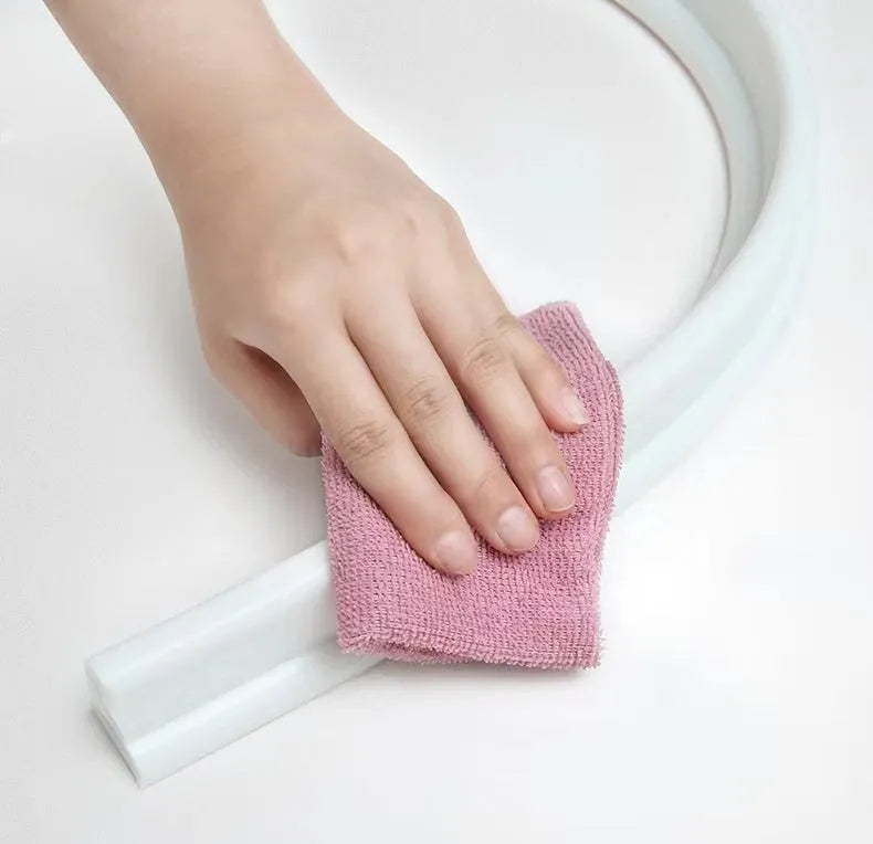 Flexible black TPE silicone water blocking strip for bathroom shower floor.