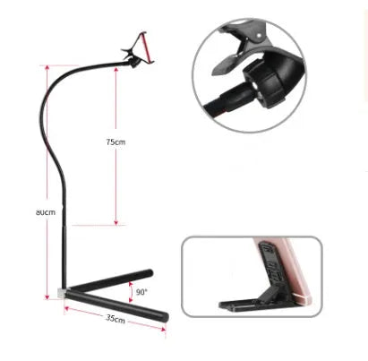 Black bedside mobile phone bracket with adjustable overhead shelf holding smartphone