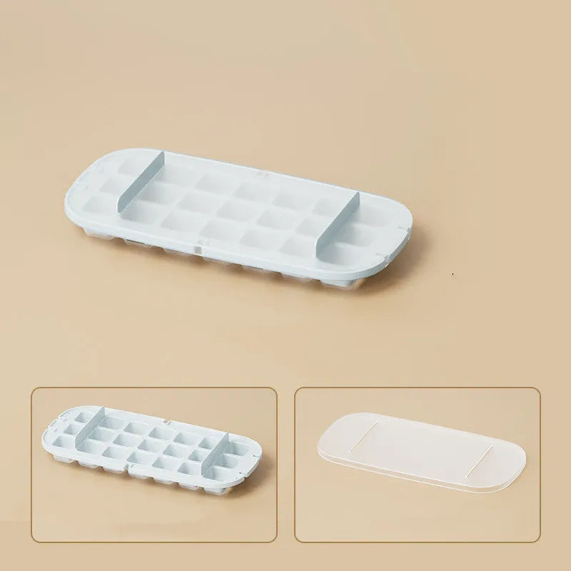 High capacity blue ice cube tray with ice grid and attached storage for the included shovel.