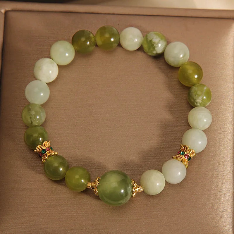 Women's Xiuyan jade bracelet in jade green with an original sweet mori style design.
