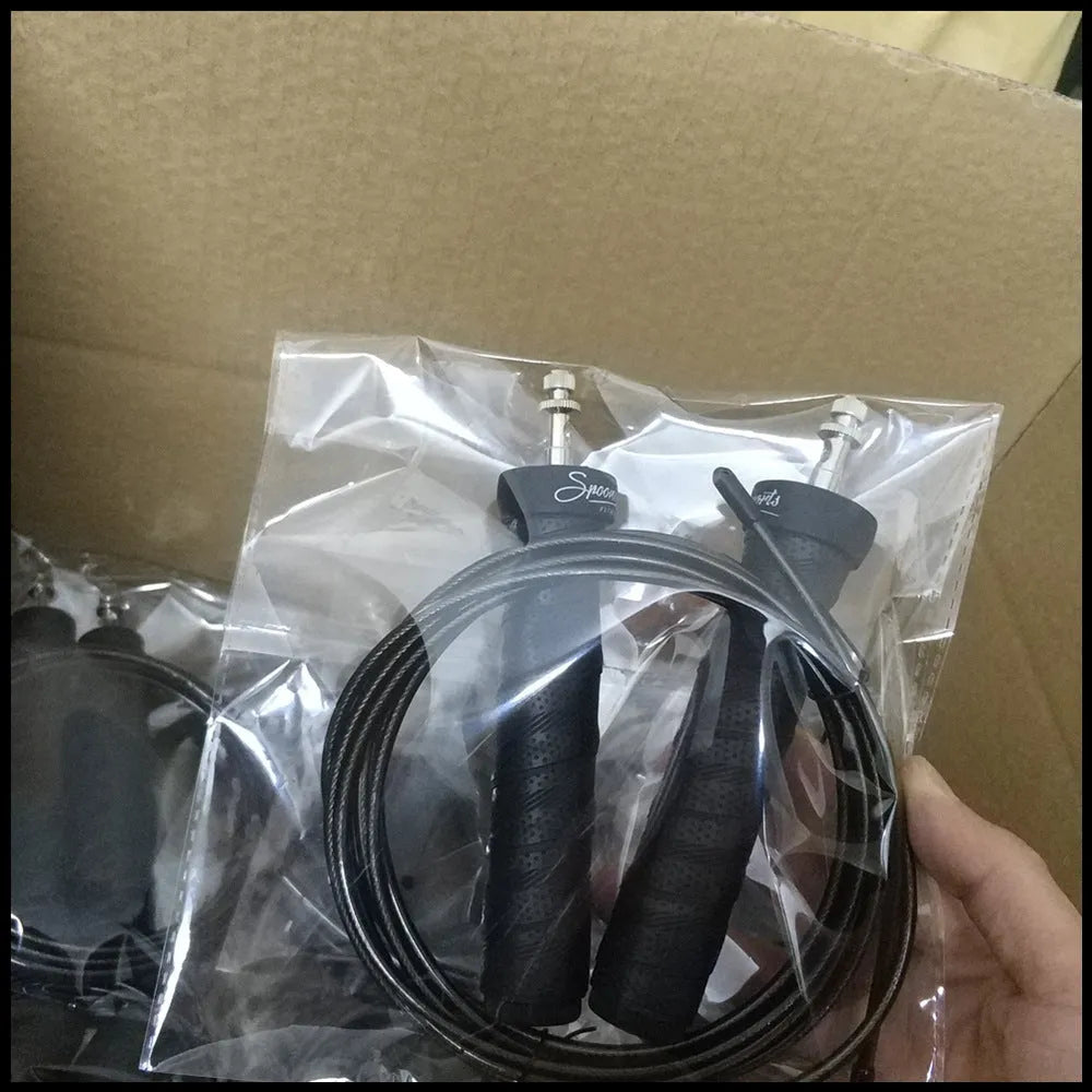 Jump rope with black PP handle, PU sweat belt, PVC wire rope on blue background