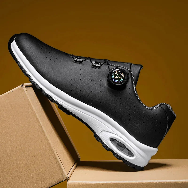 Black and white low-top mesh casual tennis shoes with cross shoulder straps and flat soles.