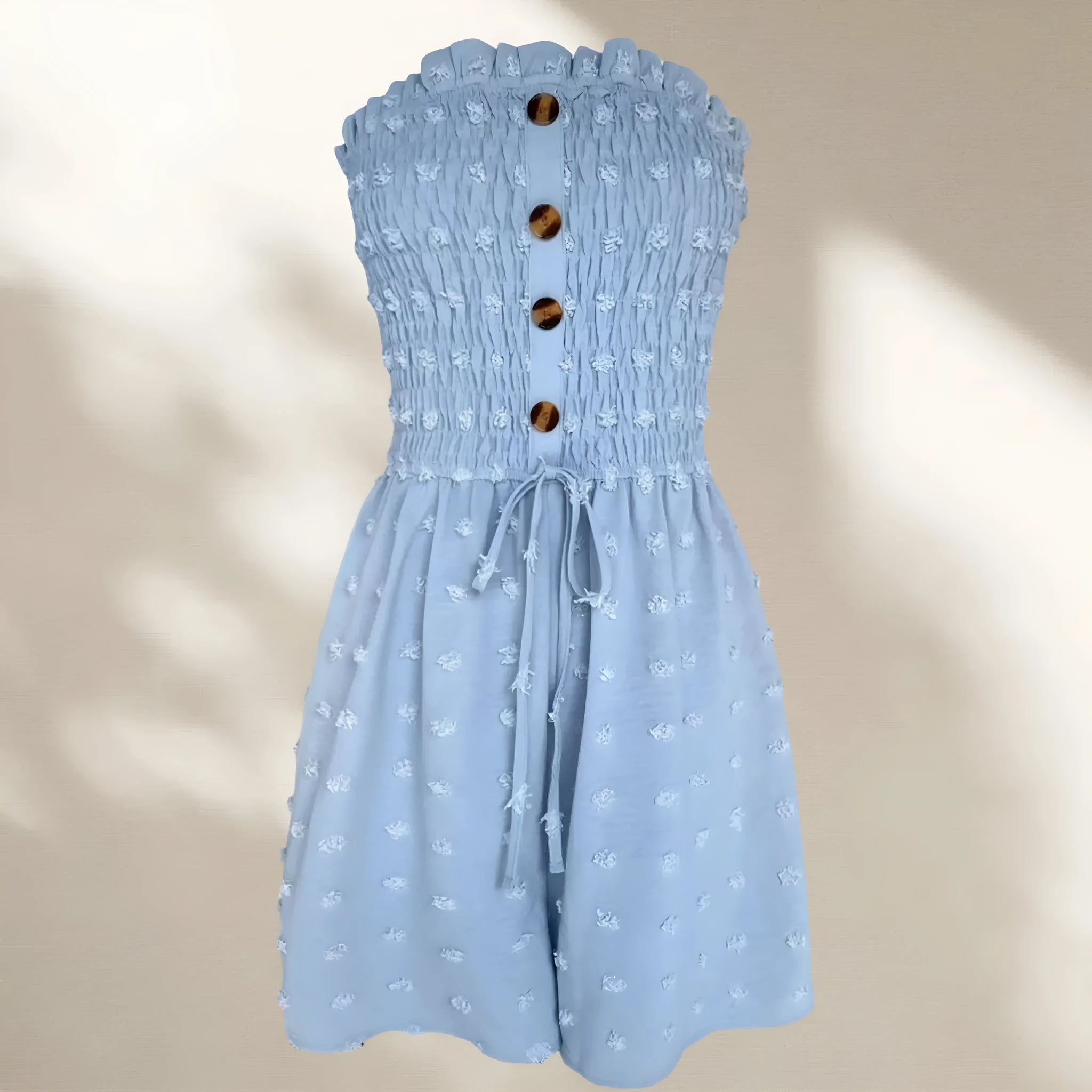 Blue off-shoulder sleeveless women's jumpsuit with button detail and cropped legs.