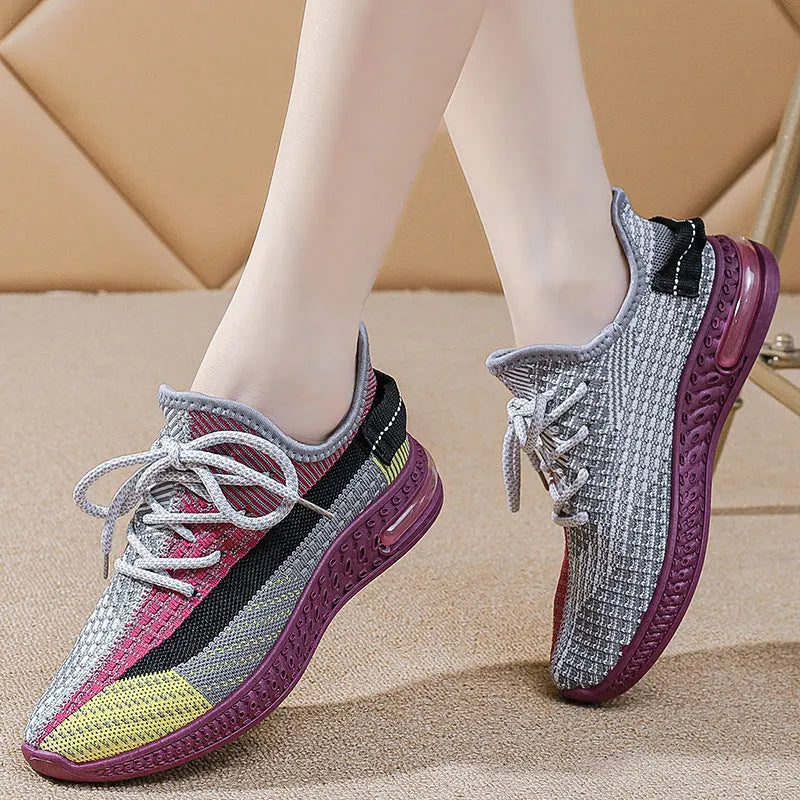 Women's casual running shoes in purple, black and orange colours with round toe and lace-up design
