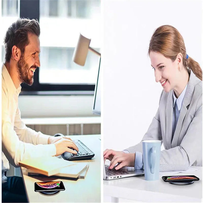 Black Qi fast wireless charging pad for smartphones on a desk