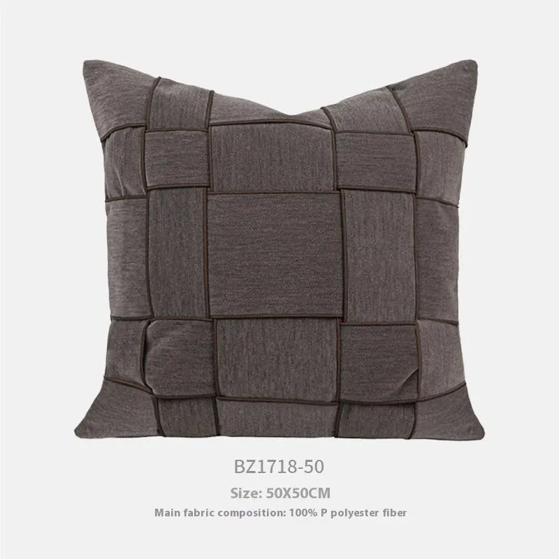 Square chenille woven cushion in a choice of colours, shown on a sofa, measuring 50x50cm.