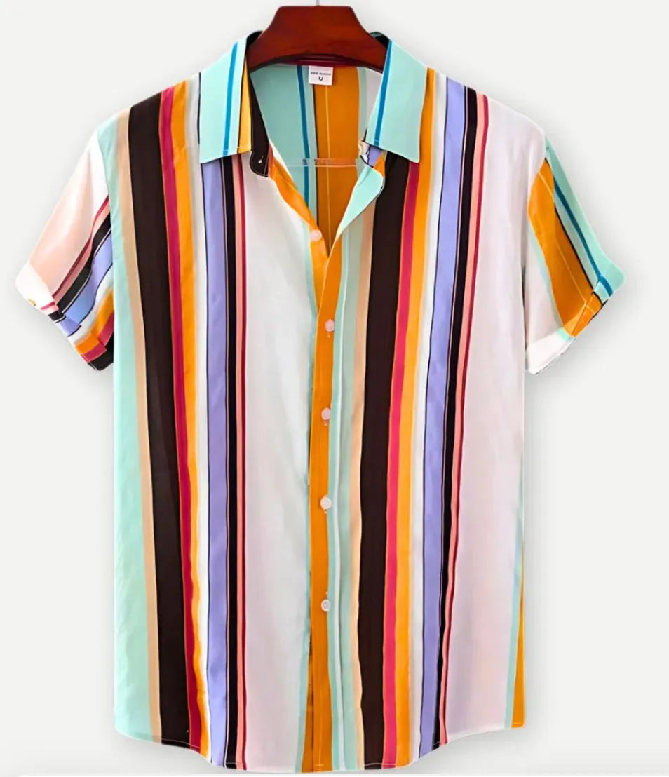 Man wearing a short sleeve Hawaiian shirt with a blue and white floral digital print and a lapel collar.