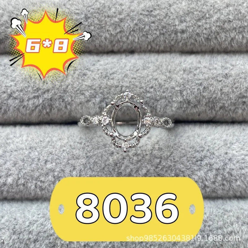 Oval open mouth copper ring with a 6*8 centre stone and five-pointed star ornament detail.