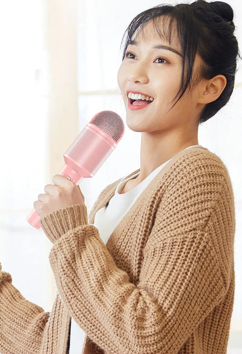 Girly pink wireless Bluetooth karaoke microphone with USB connectivity style.