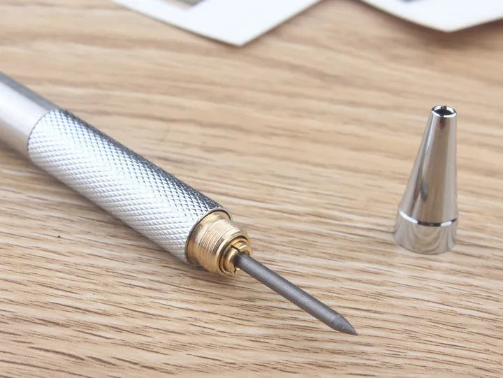 Silver metal mechanical pencil with clip, shown with compatible lead refills in sizes 0.5mm and 2.0mm.