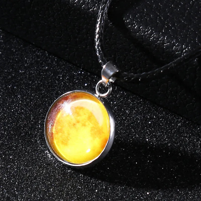 Luminous alloy necklace with a glass pendant depicting a Christmas moon night sky, showing the extension chain.