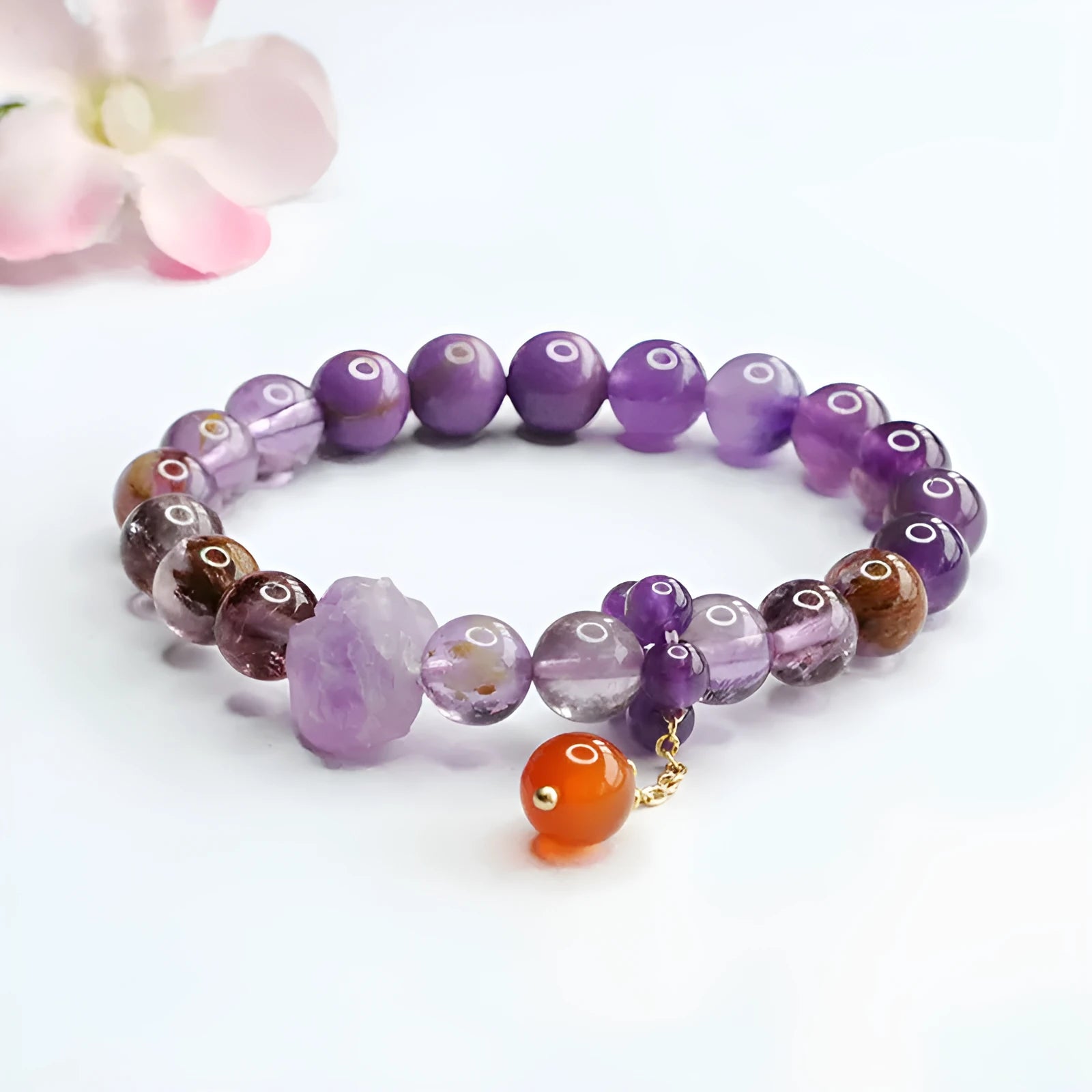 Natural Nine Purple Amethyst and red agate Mori style bracelet on wrist.