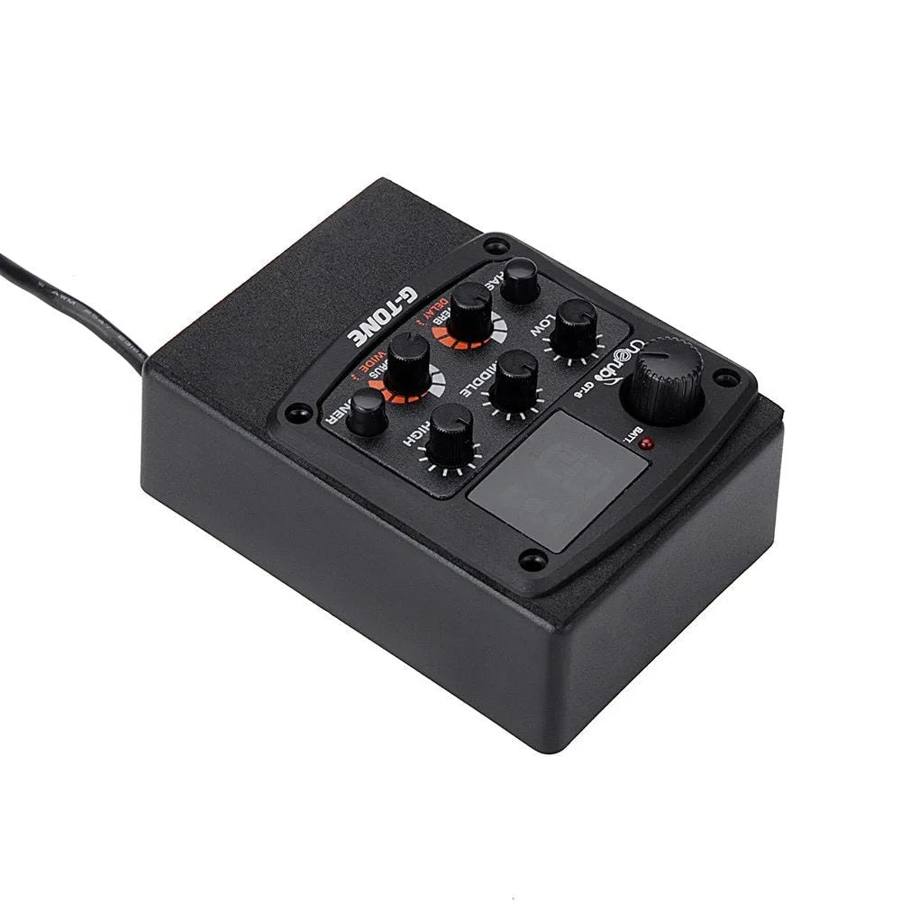 Black Cherub GT-6 acoustic guitar EQ pickup control unit with knobs for tone, volume, and effects.