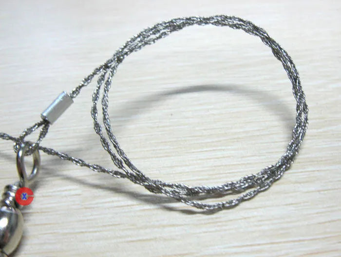 Stainless steel survival wire saw with thumb rings, showing extended length of 70cm.