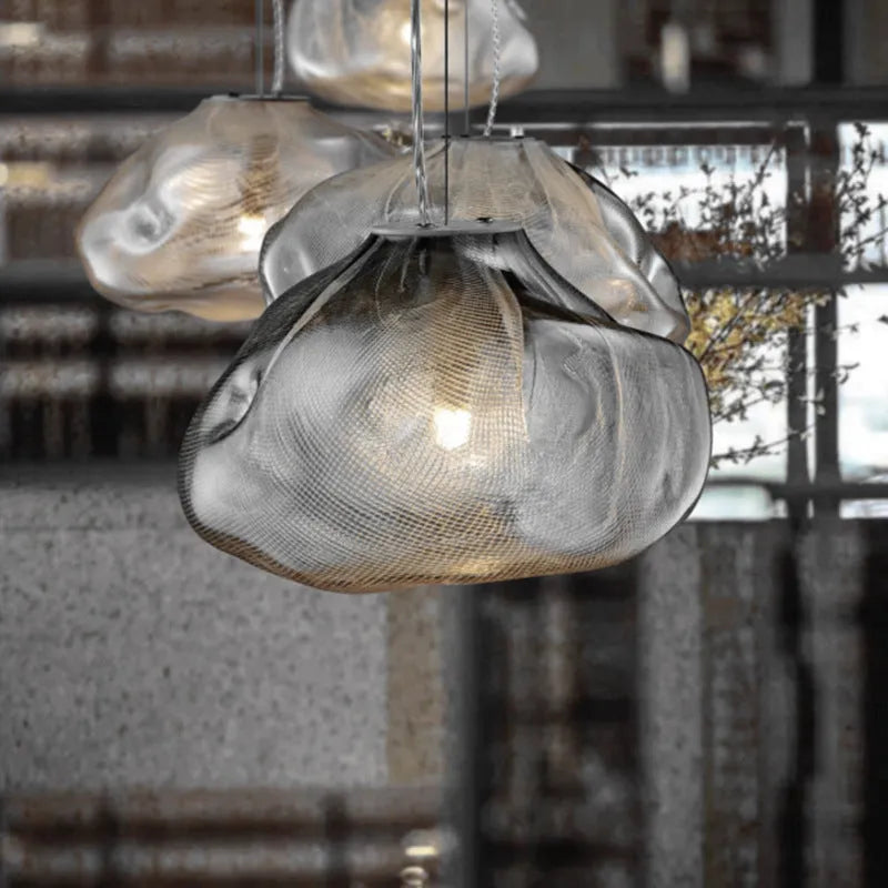 Modern fabric chandelier with glass shade in amber, clear, or smoke grey colour, shown in large and small size options.