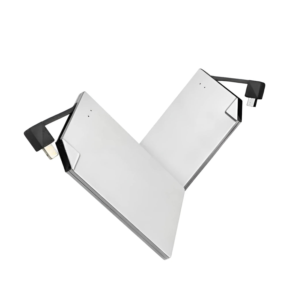 Ultra-slim silver graphene battery power bank 4000mAh on surface with cables