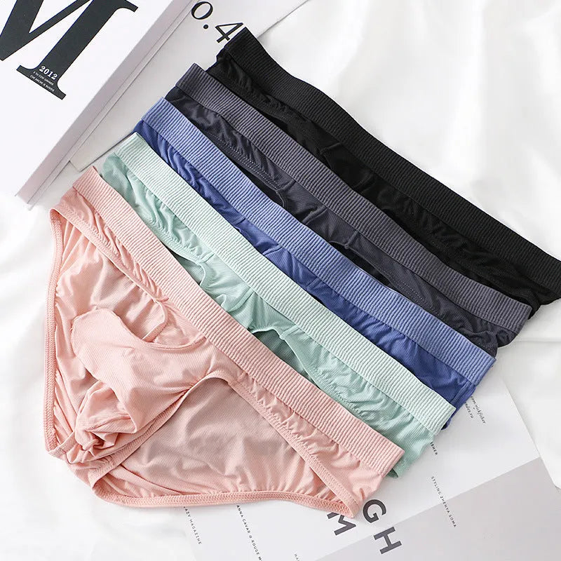 Men's low waist briefs underwear in ice silk fabric on a colour swatch showing black, grey, blue, green, and pink.