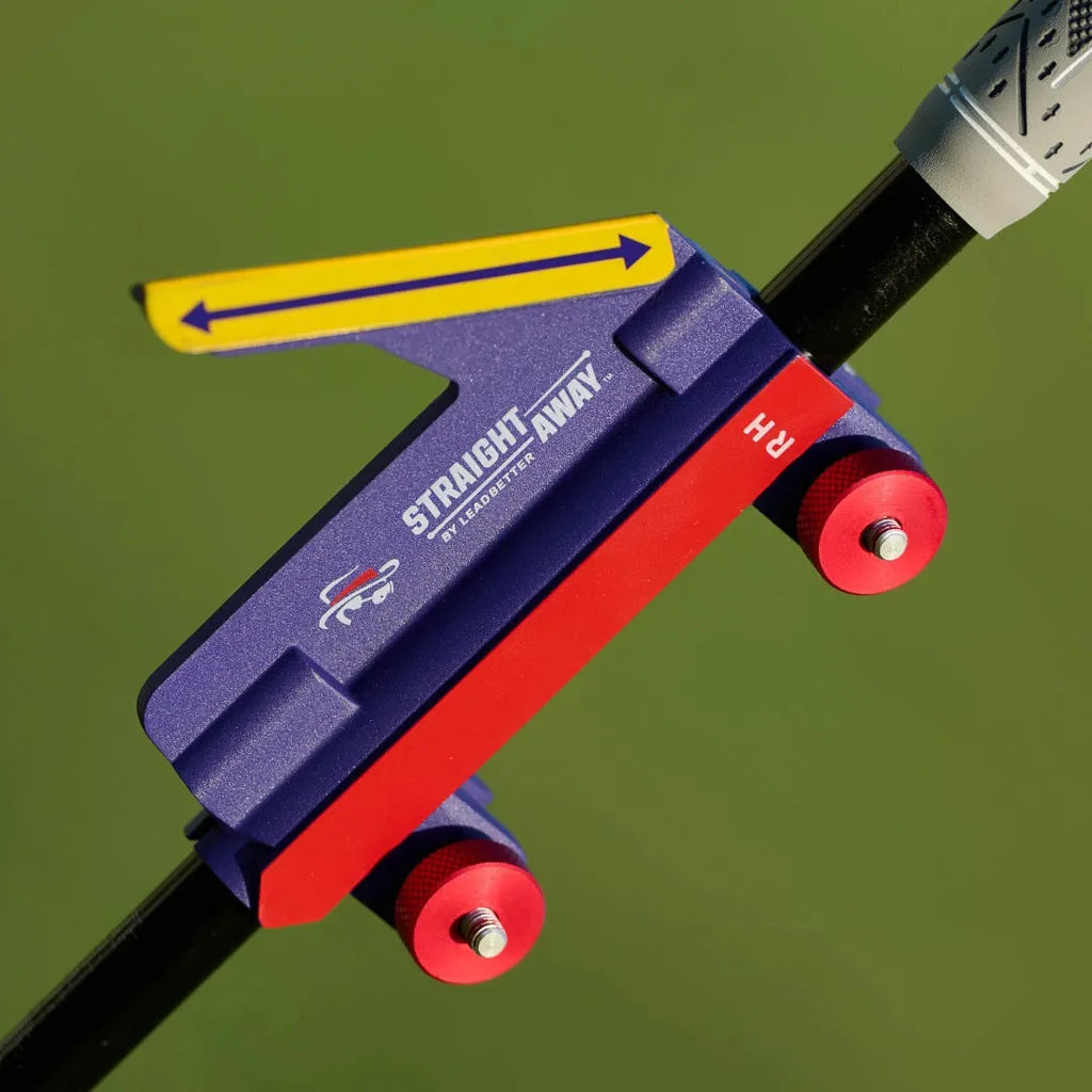 Plastic golf swing plane trainer simulator on a plain background.