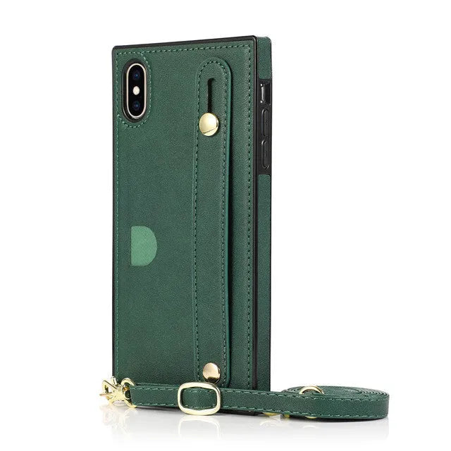 Leather iPhone case with card slots on the back and an attached black wrist strap.