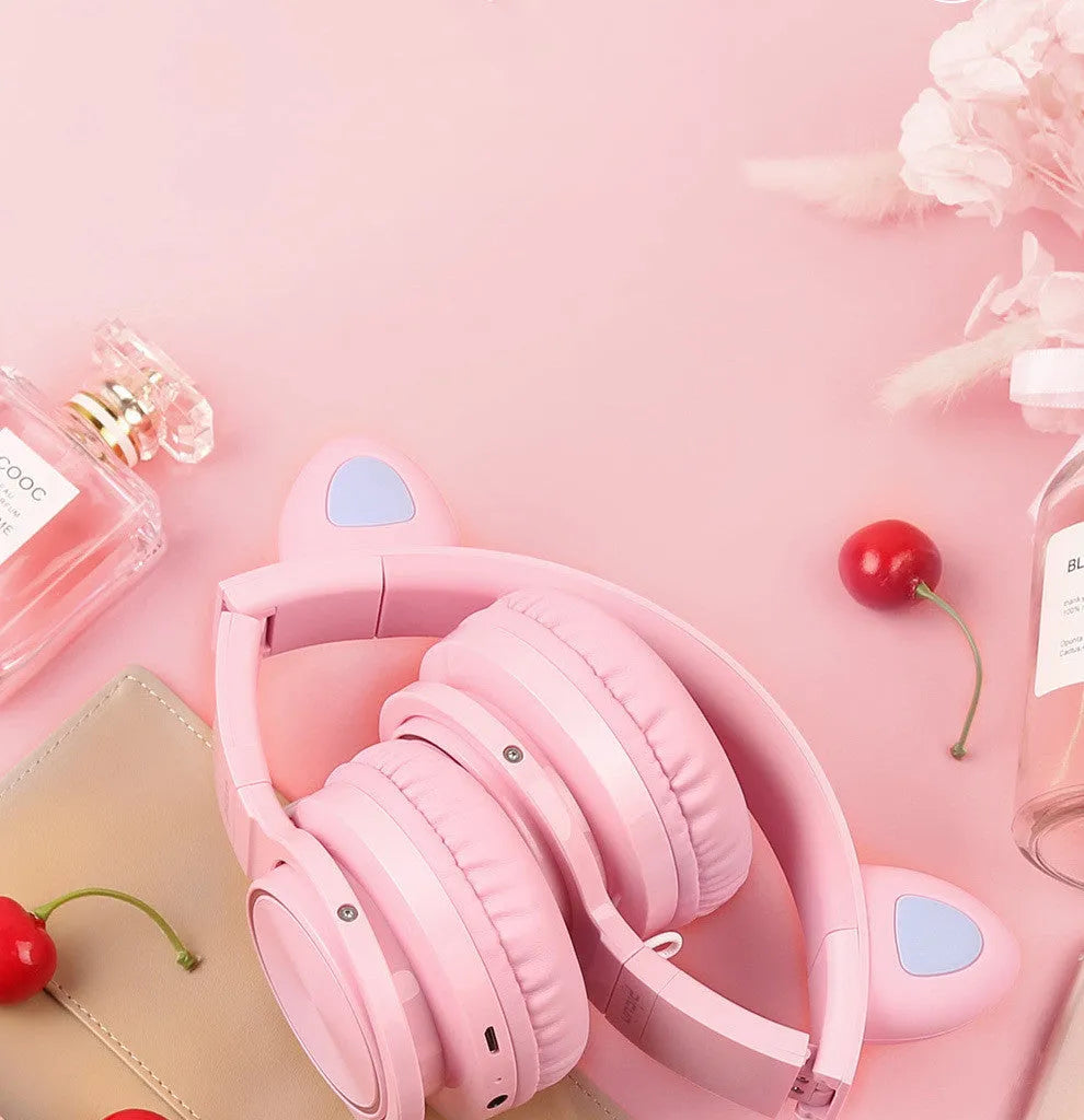 Pink and white luminous Bluetooth wireless headset with head-mounted design and 40mm speakers