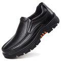 Men's black and brown cowhide leather slip-on business casual shoes with a rubber sole.
