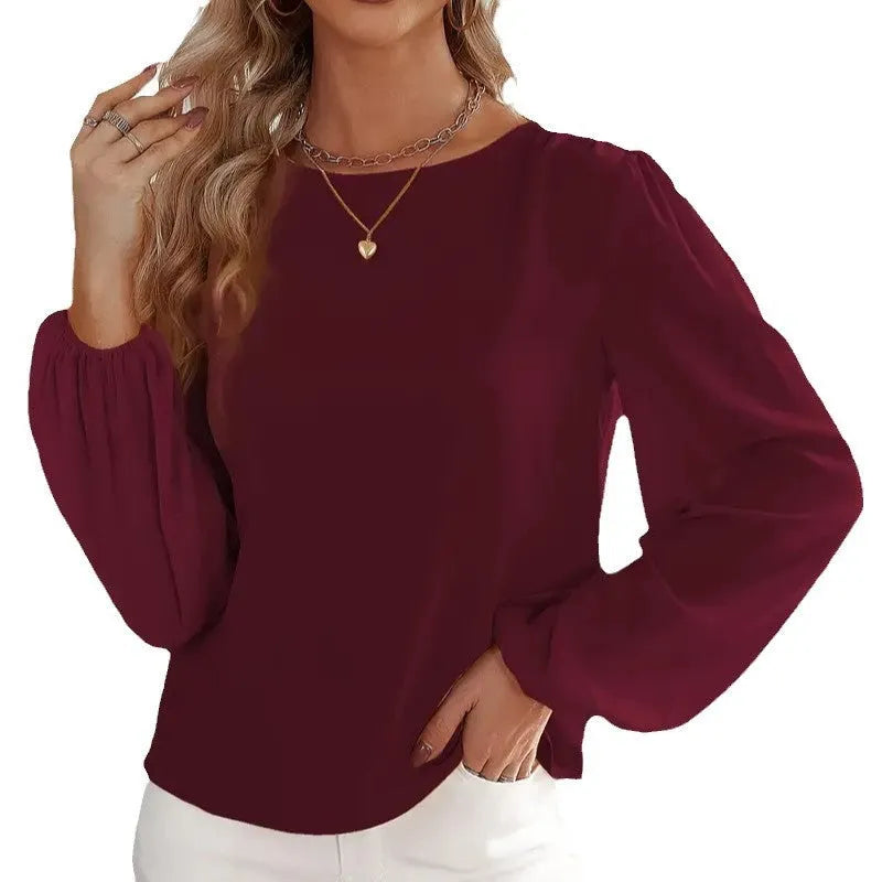 Wine red women's solid colour round neck long sleeve polyester top with button front, shown on a model.