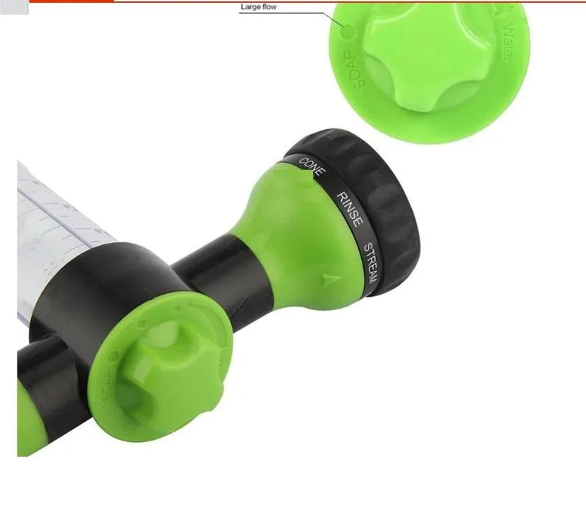 Green high-pressure foam spray gun with adjustable nozzle and attached water pipe for car and garden cleaning.