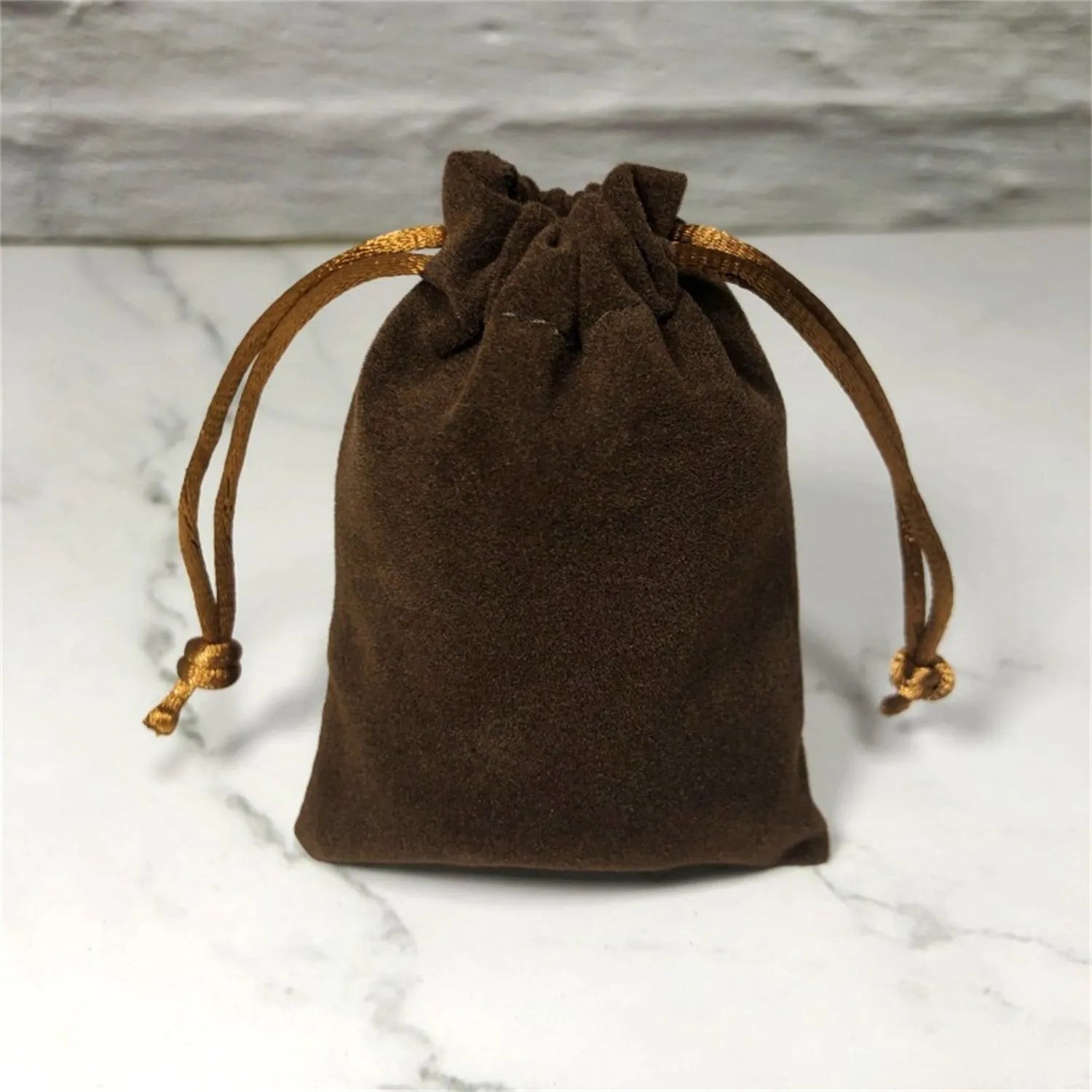 Flannel drawstring bag with beam opening, available in multiple colours and sizes for storage or gifting