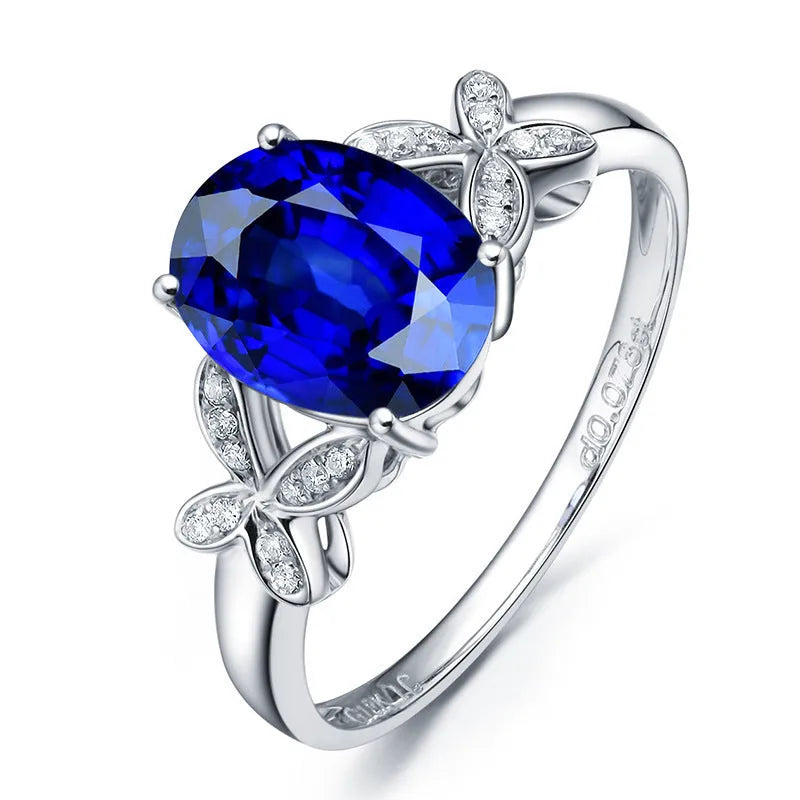 Women's rose gold plated butterfly ring with heart charm in red or blue colour options