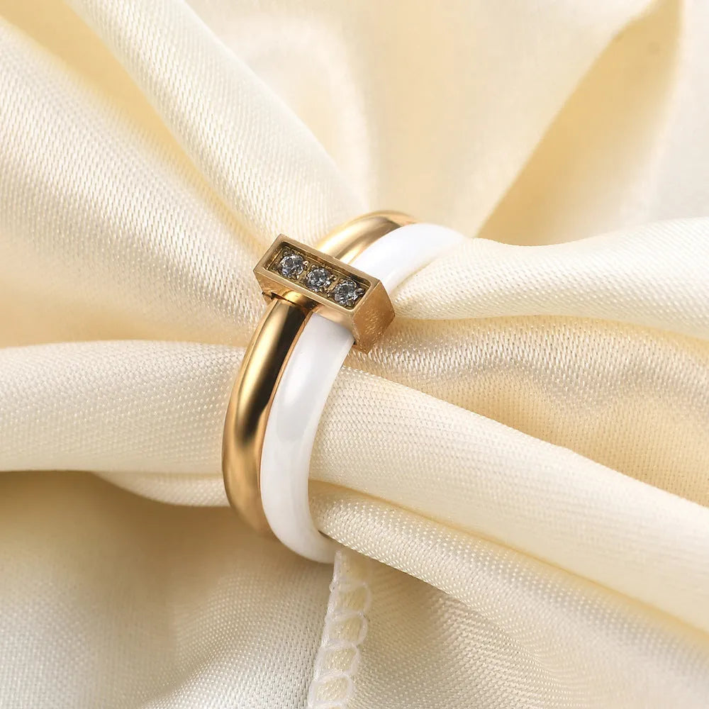 Geometric ceramic women's ring with round zirconium inlay and glossy stitching in steel black or golden white finish