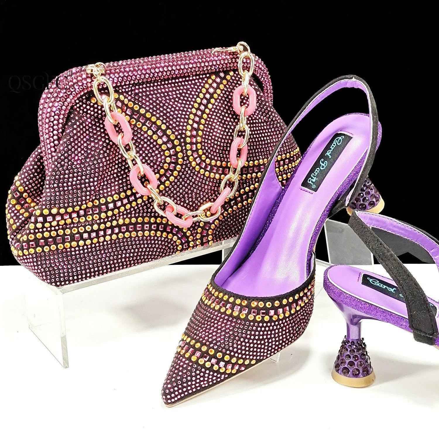 Women's pointed toe high heel shoes with rhinestones and matching small bag in blue.